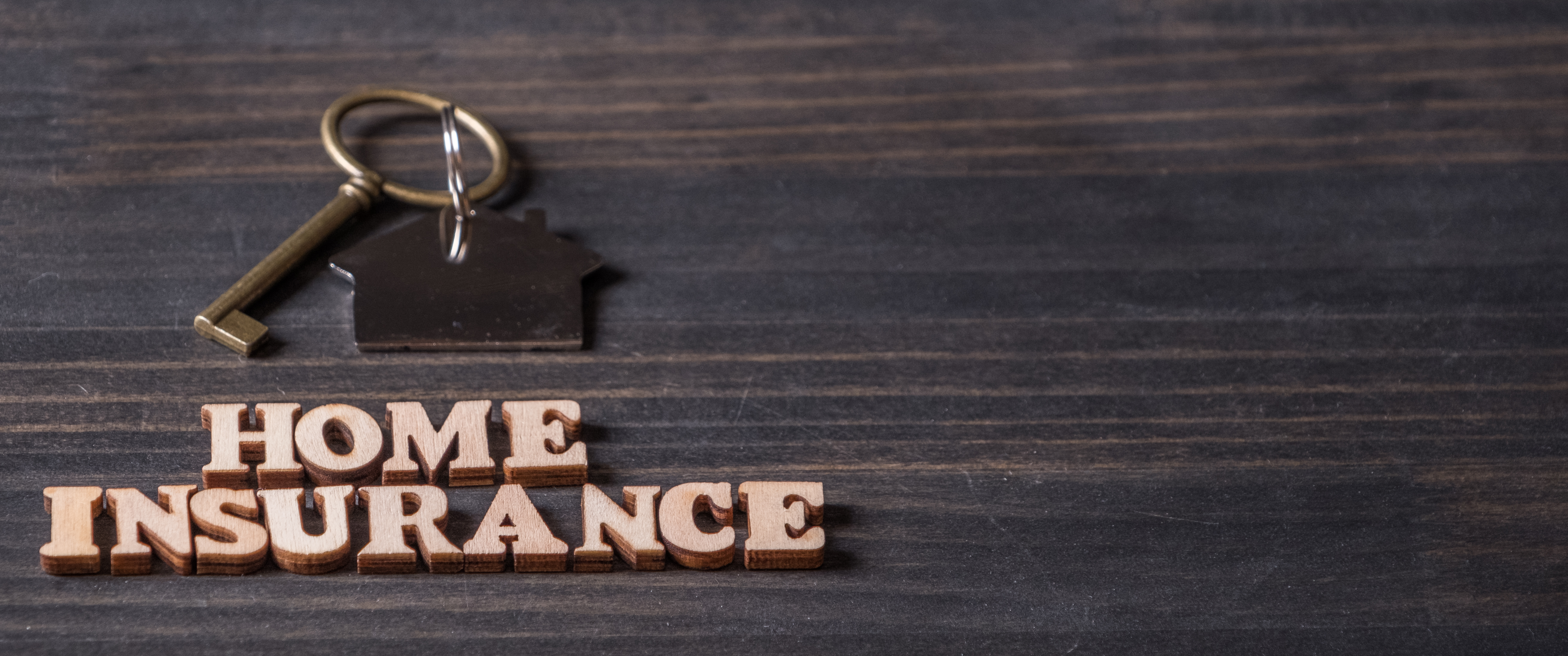A key chain opening the door to home insurance companies
